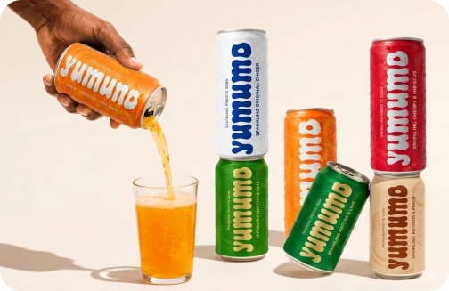 Branded beverage cans and poured drinks in a product campaign