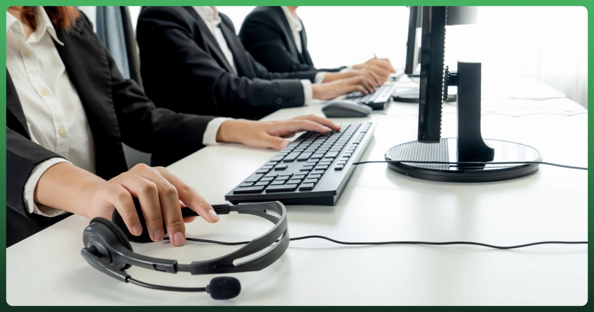 Customer support team working at computers with headsets, representing ecommerce customer service and learning resources