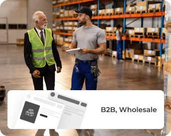Warehouse professionals reviewing inventory for Shopify Plus B2B and wholesale commerce solutions