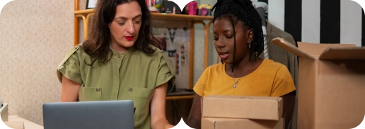 Two professionals collaborating on an eCommerce project using a laptop